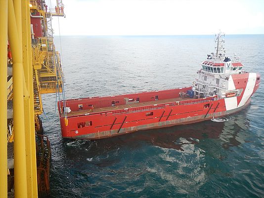 Supply vessel delivering a 2TI hoist and the replacement diesel engine to the offshore platform.