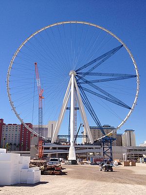The Las Vegas High Roller observation wheel under construction, showing the outer rim completed with final radial spokes to be added before removal of the temporary radial struts.