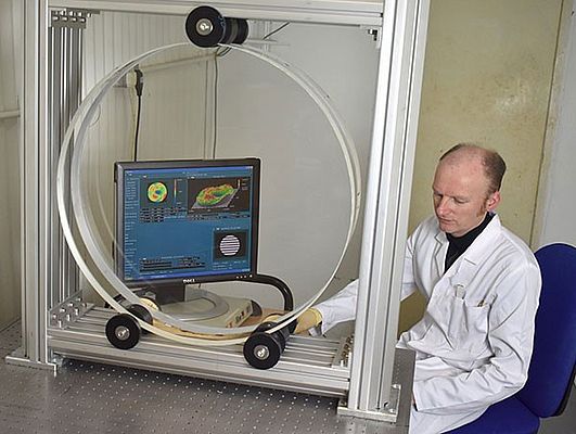 A large diameter optical window being quality tested (courtesy: Optical Surfaces Ltd)