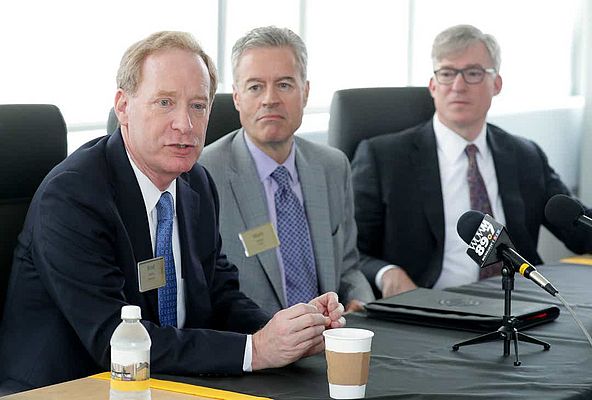 Microsoft president Brad Smith (from left) and University of Wisconsin-Milwaukee chancellor Mark Mone, with Rockwell Automation CEO Blake Moret, announced a $1.25 million gift to support the school's investment in smart technology