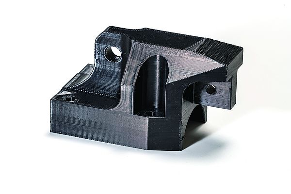 Alloggiamento della testa trolley stampato in 3D in resina resistente Stratasys ULTEMTM 9085 sulla F900